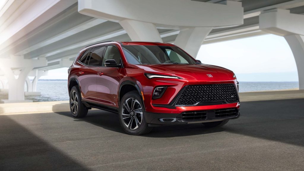 2026 Buick Enclave red SUV parked under a modern bridge
