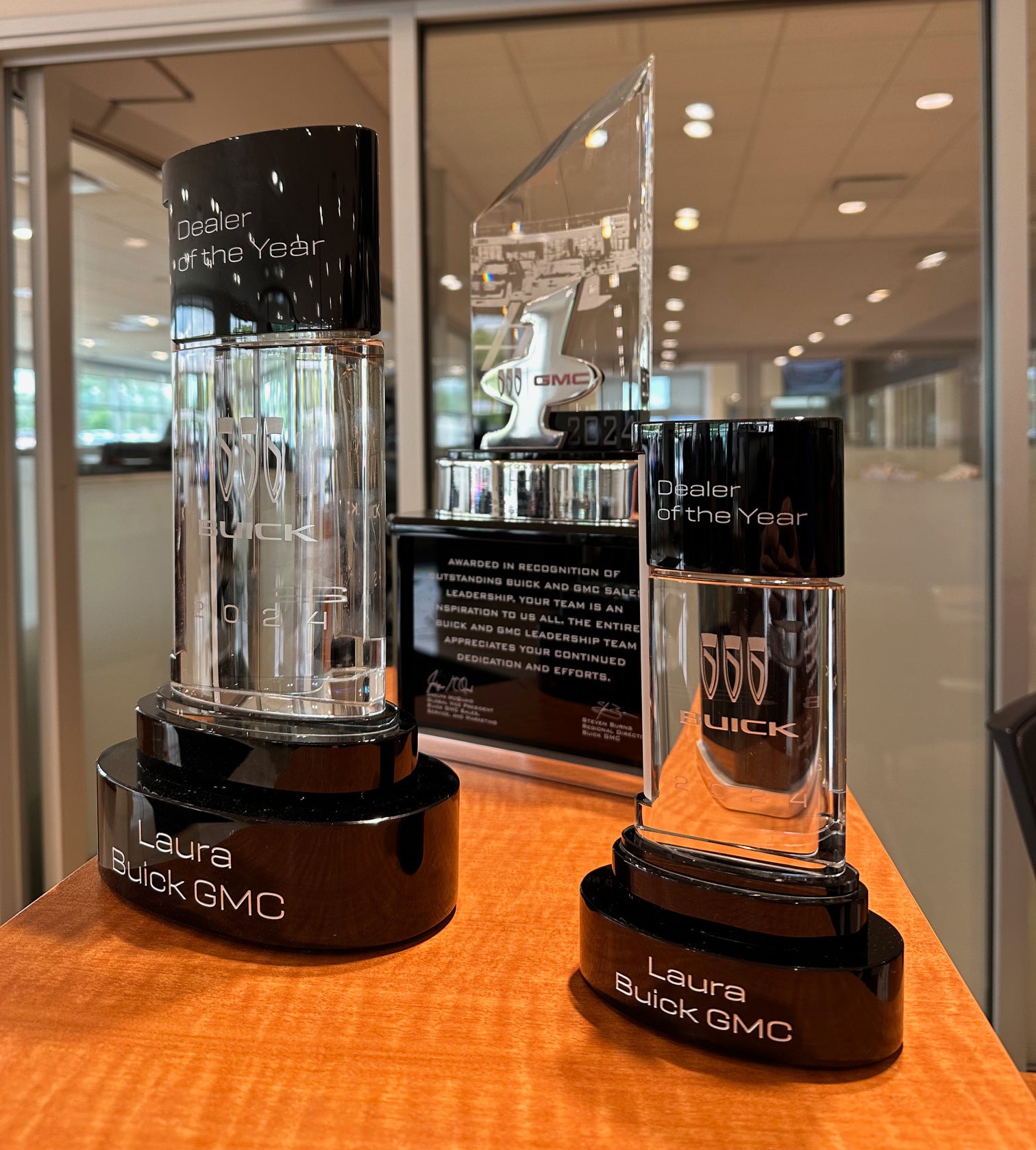 Laura Buick GMC awards displayed in showroom